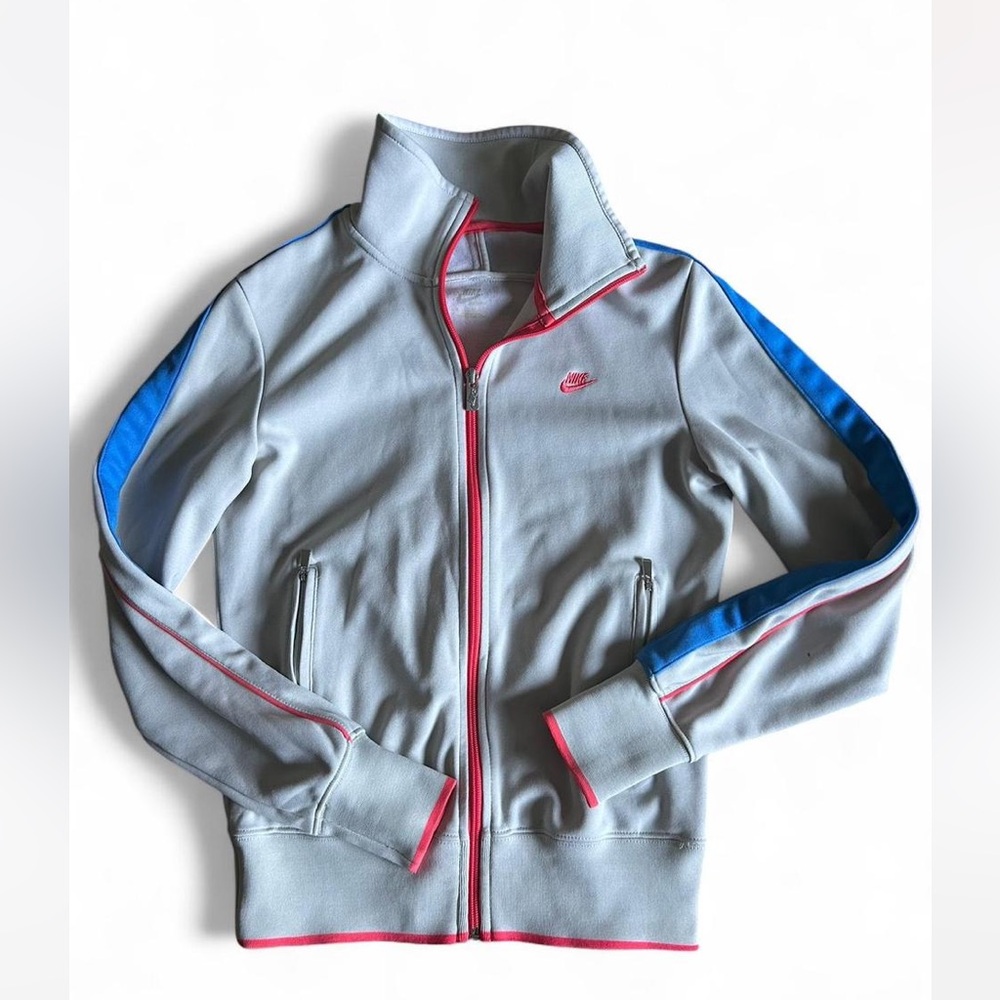 Nike track jacket off-white with blue and pink accents. Women’s Size Medium